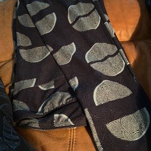 Shades of blue with an abstract design of green LulaRoe leggings Tall and Curvy